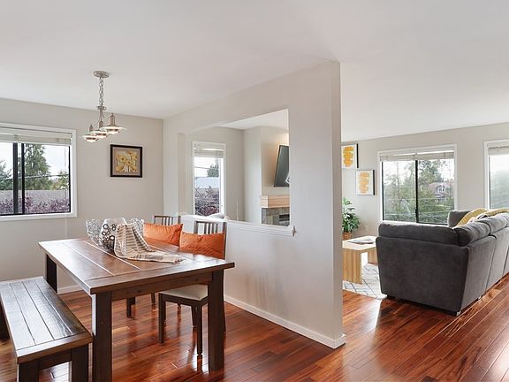 The living and dinning rooms are defined by a wall yet are open to one another thus visually expanding the space!