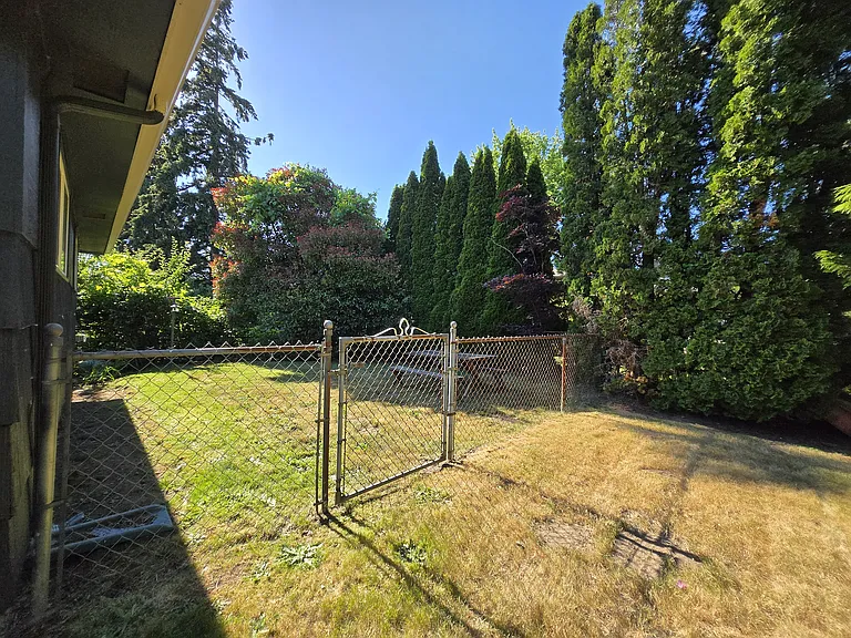 Fenced side yard.