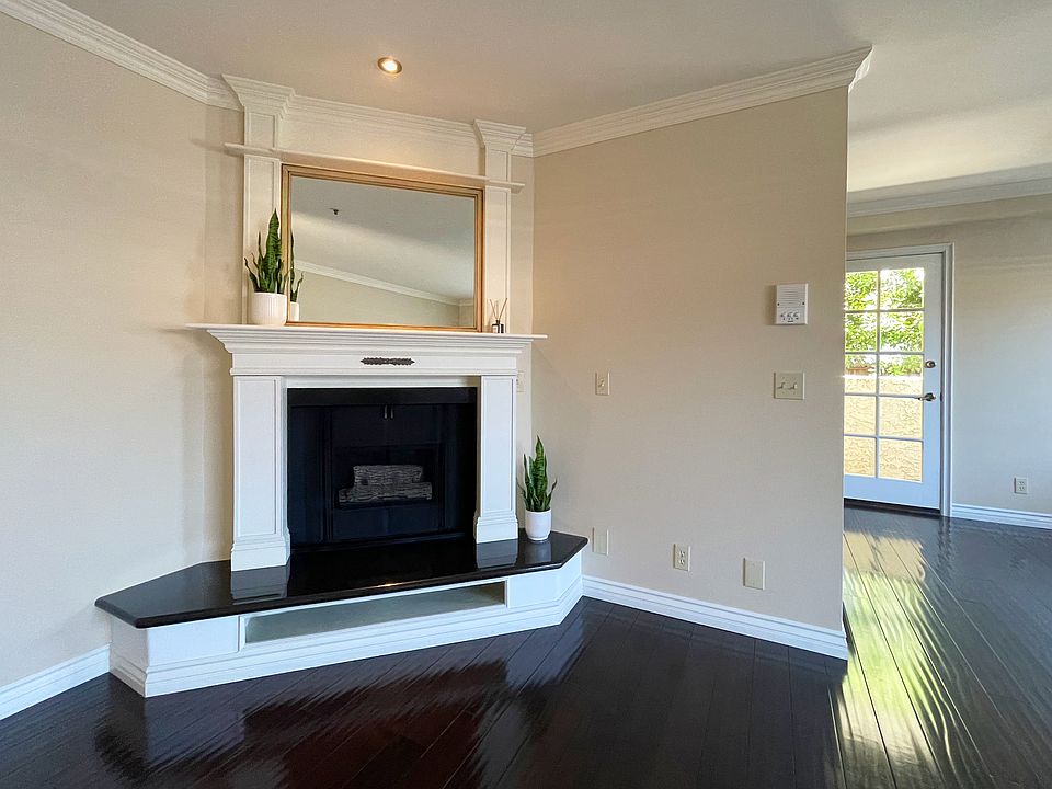 Gas fireplace with custom, black mantle & mirrored mantle