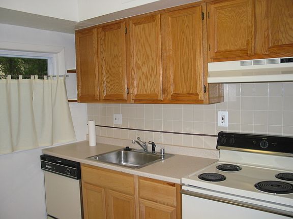 Kitchen with electric stove, dishwasher, refrigerator, all l