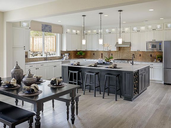 Kitchen from Family Room - Photos are of a similar home