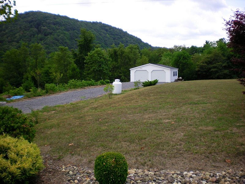 2 car garage situated on 2 +/- acres of land. A beautiful country setting!