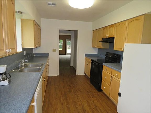 Kitchen with new vinyl plank flooring.