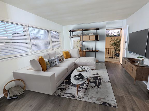 Living room, to upper enclosed patio, staged