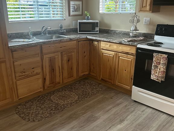 Full kitchenette with fridge and stove