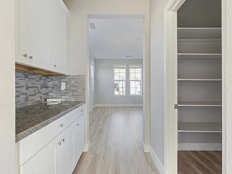 Kitchen walk-through to dining room