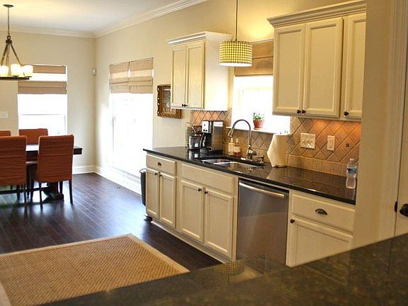 Top and Bottom Cabinet Space topped by Dark Granite with Ext