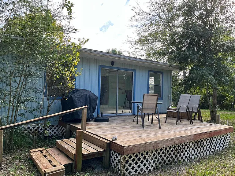 Back deck, grill and furniture included.