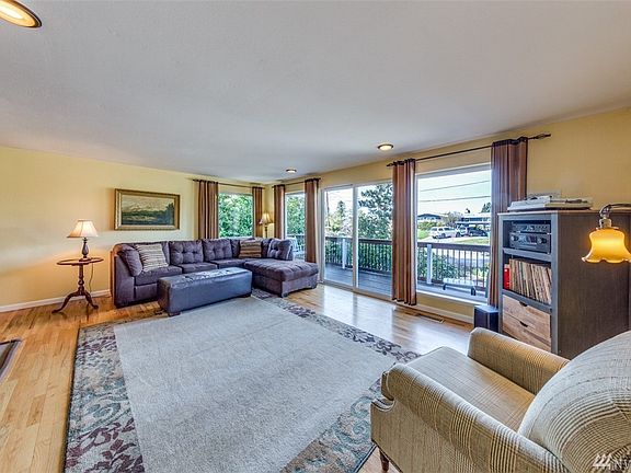 The upper level living area is light and bright a nice front deck for enjoying those beautiful PNW sunsets.