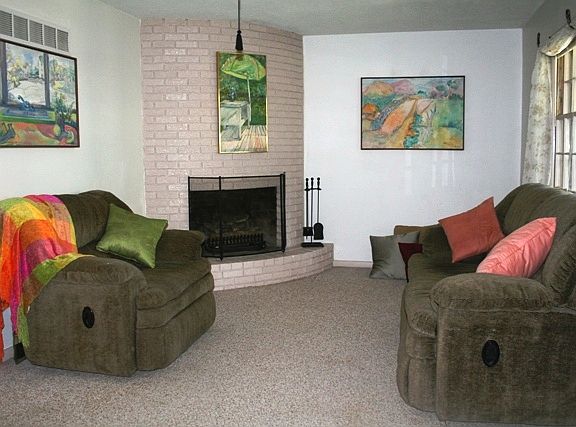 Living Room with curved Fireplace