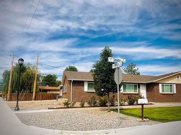 East-facing front door with grassy front yard and maintenance-free rock landscaping throughout. New sidewalks (2023) are 2x as wide as normal, providing safe transit to the RTD light rail 2 blocks away.