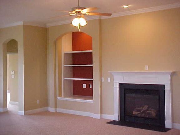 Family Room w/Cozy Fireplace & Built-in Bookcase.