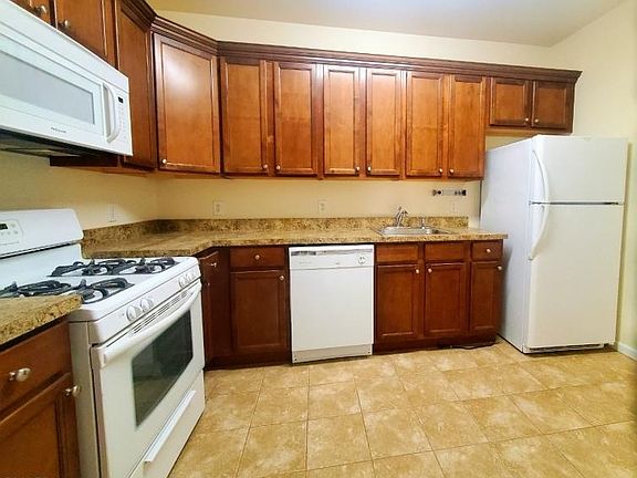 Renovated EAT IN Kitchen w/ newer appliances, 36" maple cabinets and tile floor