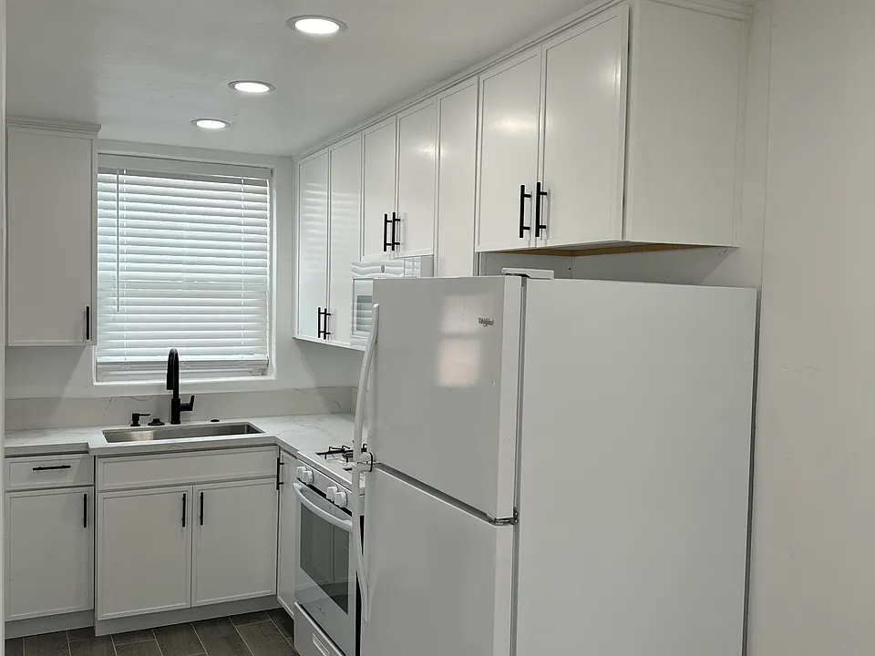 Remolded kitchen with new lighting and kitchen cabinets and new appliances