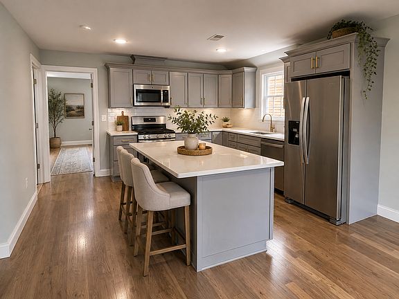 Stairwell leads right into the newly renovated kitchen with all updated appliances