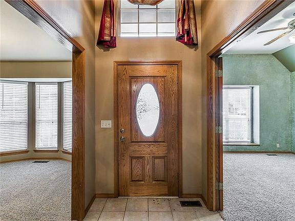 Front door entry area with view of Study on one side and formal dining on the other.