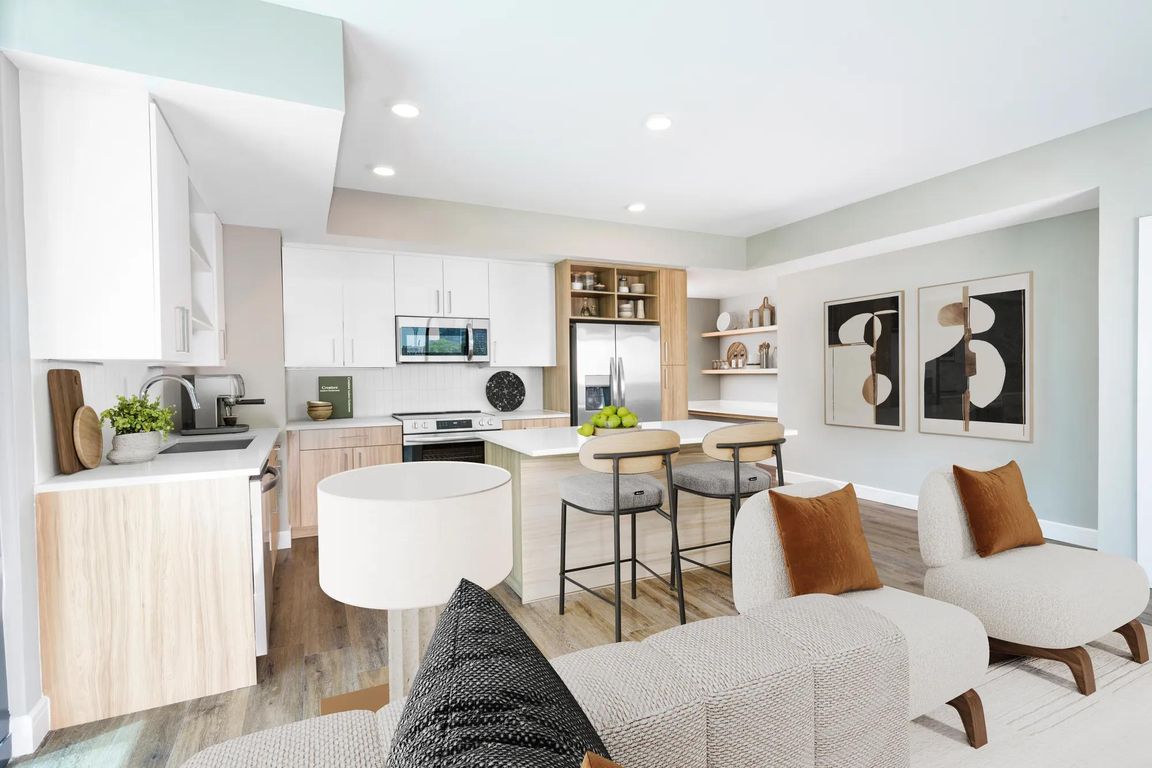 Sleek lines, wood-style flooring, and custom cabinetry_our open-concept kitchens create a clean, contemporary space perfect for everyday living or entertaining.