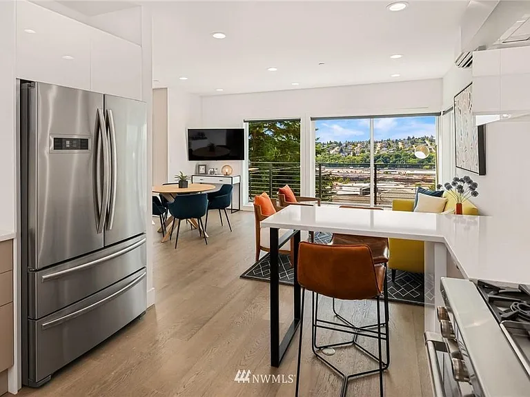 Prepare meals in the kitchen with a beautiful cityscape in sight.