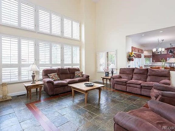 Two story great room, Soaring ceilings, beautiful stone floors with wood inlay.  Plantation shutters.