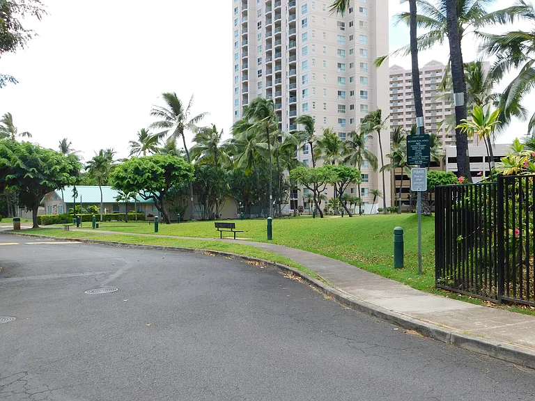 Large green area next to the building manager's office and pool. Complex also has high rise buildings; those residences have tandem parking stalls.