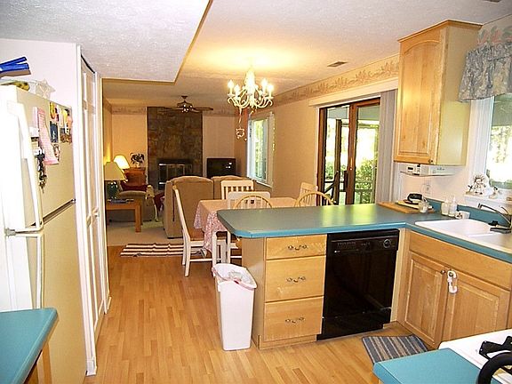 Kitchen is open to the famiy room and screened porch.