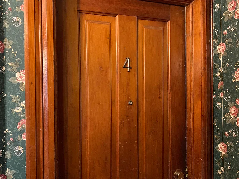 Unit Entrance. This unit is UPSTAIRS in the shared foyer for 2 other units.