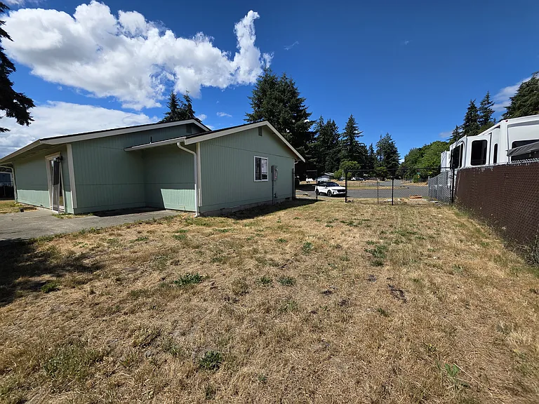 The side yard offers a gate for easy access