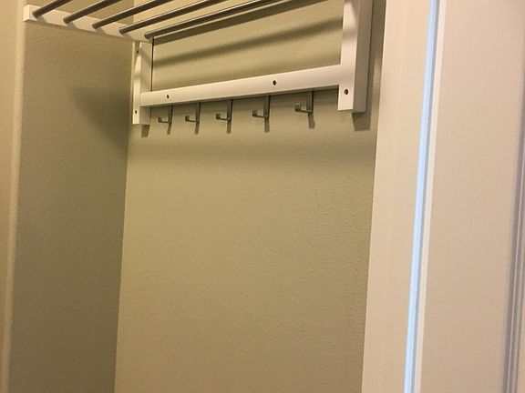 Built in coat rack shelf at front entryway