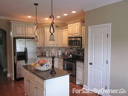 Entrance and Stone Bay Window
						:
						Notice the Mahogony Front door and the detail of the stone bay window.