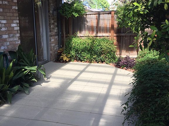 Covered patio with sprinklered garden areas