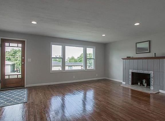 Original Hardwood Floors now gleaming in the light filled Living Room.