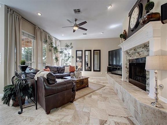 Spacious living area with beautiful extended and raised fireplace hearth