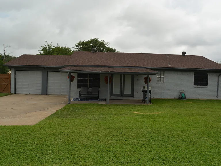 Full-fenced and spacious backyard with a covered patio, outdoor furniture and a grill for outdoor family fun!