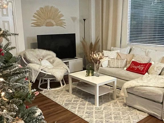 Living room with large windows and gas fireplace