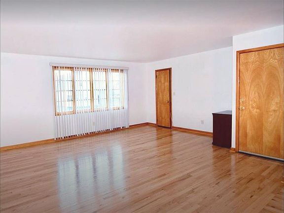 Extra large living room with large walk in coat closet. All natural light. Open floor plan with dining room.