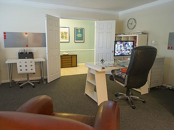 The study sits behind french doors as you enter the home and consists of working space and a place to sit and relax. Can also be transformed to a formal living area if needed.