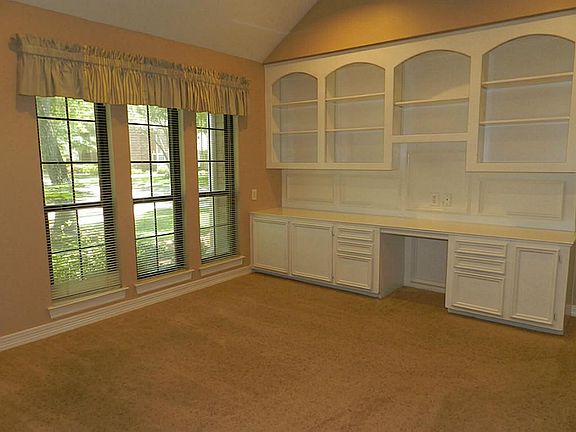 Formal Living or "Study" with a wall of Built-In Shelves & Cabinets