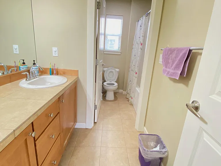 Guest Bathroom with a privacy door for efficient use of the bathroom.