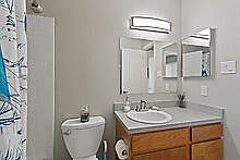 Experience the elegance of this modern bathroom, accentuated by stylish fixtures and ample lighting. Experience the elegance of this modern bathroom, accentuated by stylish fixtures and ample lighting.
