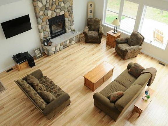 Second story view to living room below. Beautiful hickory hardwood floors.