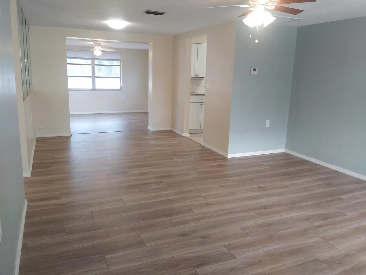 Entrance view: living room, dining room and the bonus room! New floors and paint. - 1329 Steenbok Dr