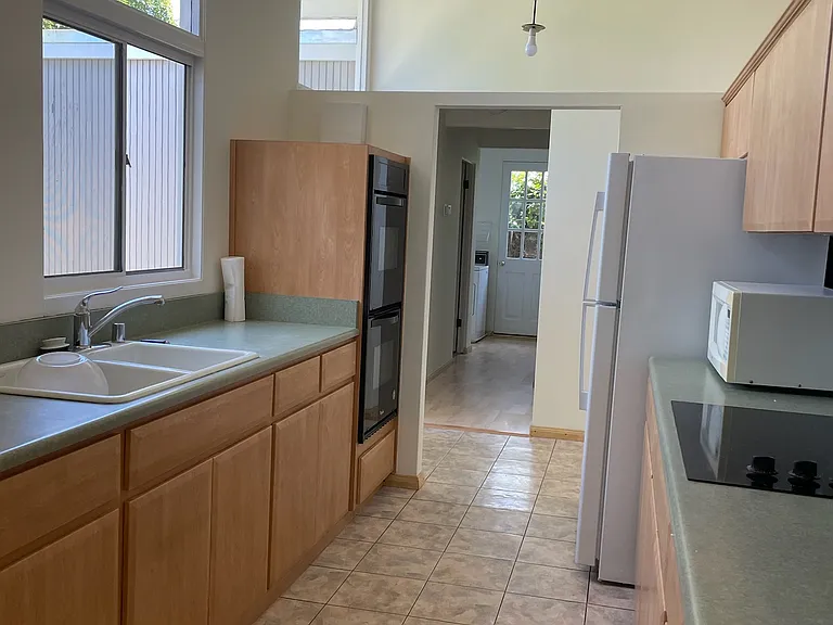 Kitchen looking towards front door and hallway