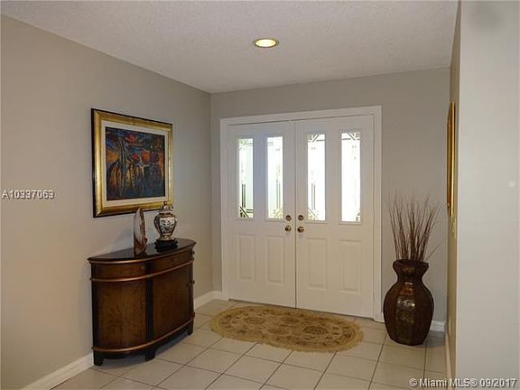 FOYER ENTRY WITH COAT/STORAGE CLOSET, A RARE FEATURE IN TODAY'S HOMES.