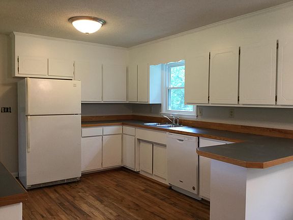 Kitchen with Whirlpool appliances and new dishwasher.