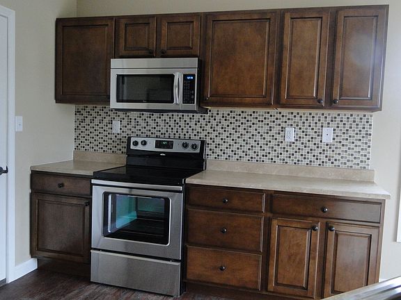 Glass Tile Backsplash, Maple Cabinets 