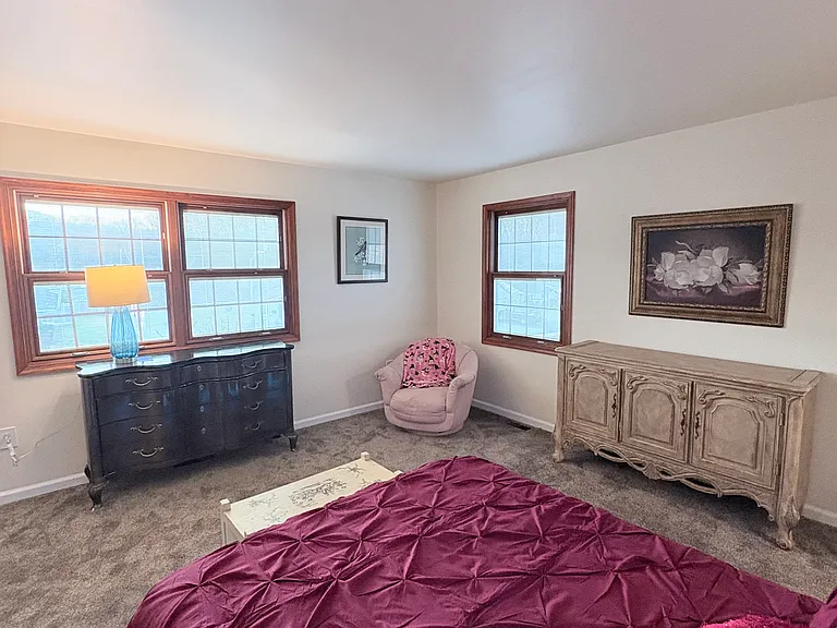 Cozy little corner perfect for reading. Windows have built in blinds.