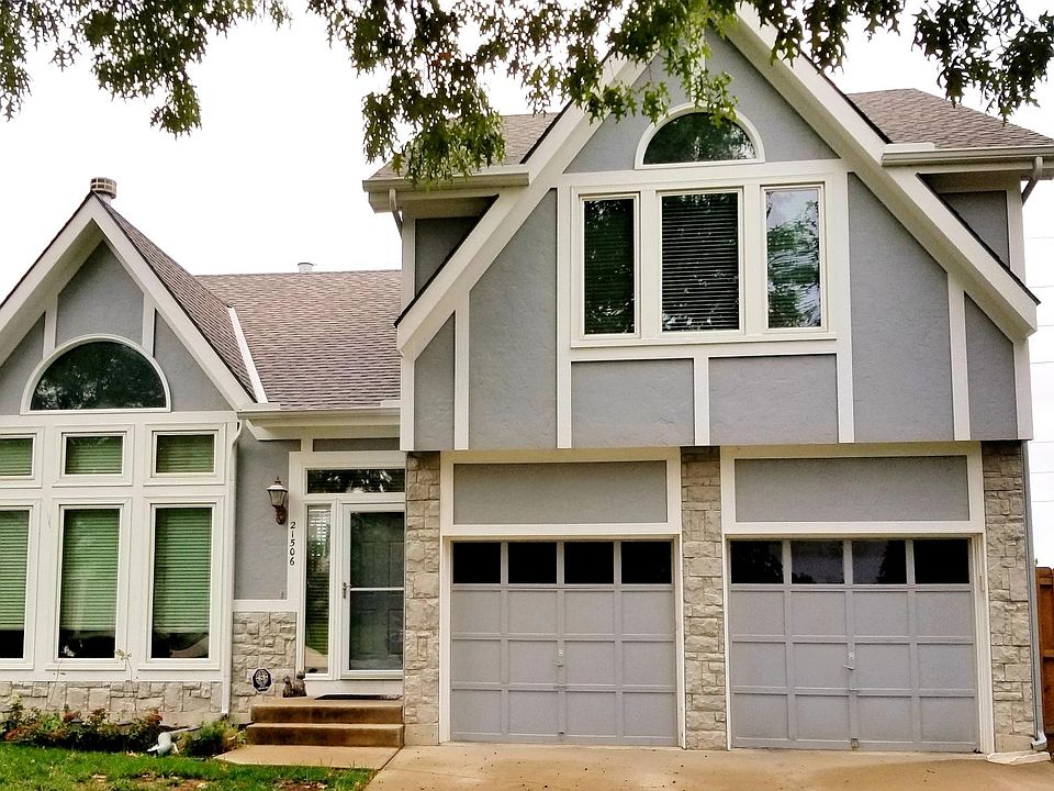Front view of the house. All windows (aside from the ones on top/side of the front door) were recently installed.