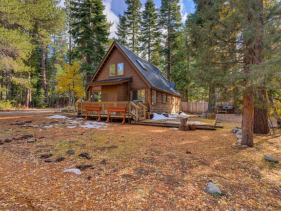 The house with side deck, I'll try to get a better one this spring! The deck is huge and holds a 14 person table along with two large chairs. To the right of the deck is another sitting area with a couch and two swivel chairs!