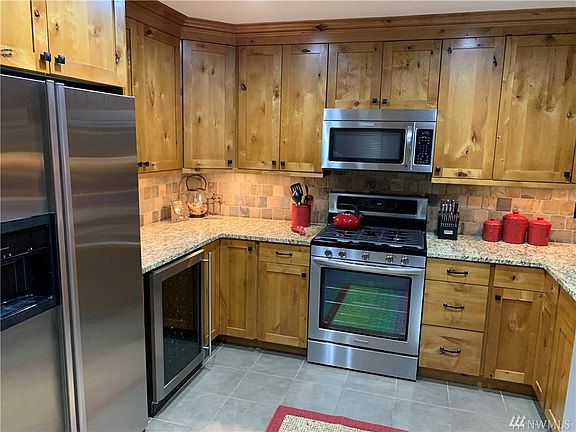 Kitchen complete with under counter lighting and wine fridge. 