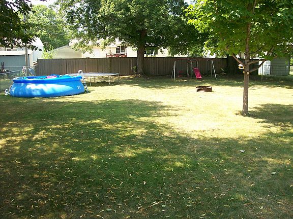 Large fenced In Yard With Mature Trees